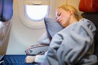 sleeping woman airplane blanket