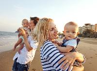 mom dad baby infants twins traveling beach travel vacation holiday