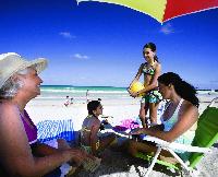 Families enjoy the soft white sand on Florida’s many pristine beaches.
