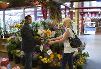 Couple with flowers at Granville Island Market